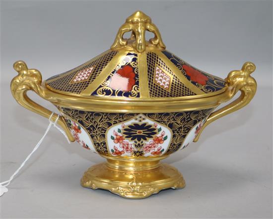 A Royal Crown Derby two-handled oval pedestal urn and cover, pattern no. 1128 width 19cm height 14cm